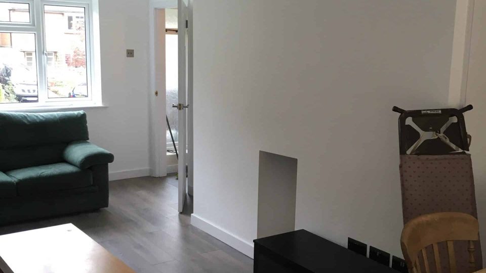 New living room with walls & ceiling & walls skimmed, with new flooring & skirting boards