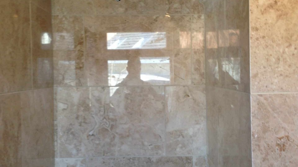 Shower area walls tiled, ceiling skimmed & painted