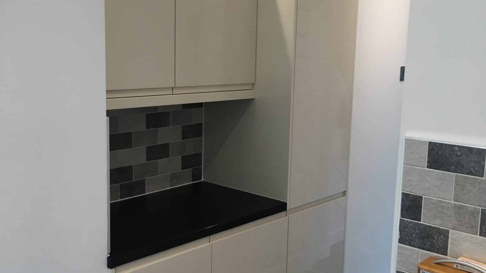 Kitchen walls tiled & units fitted