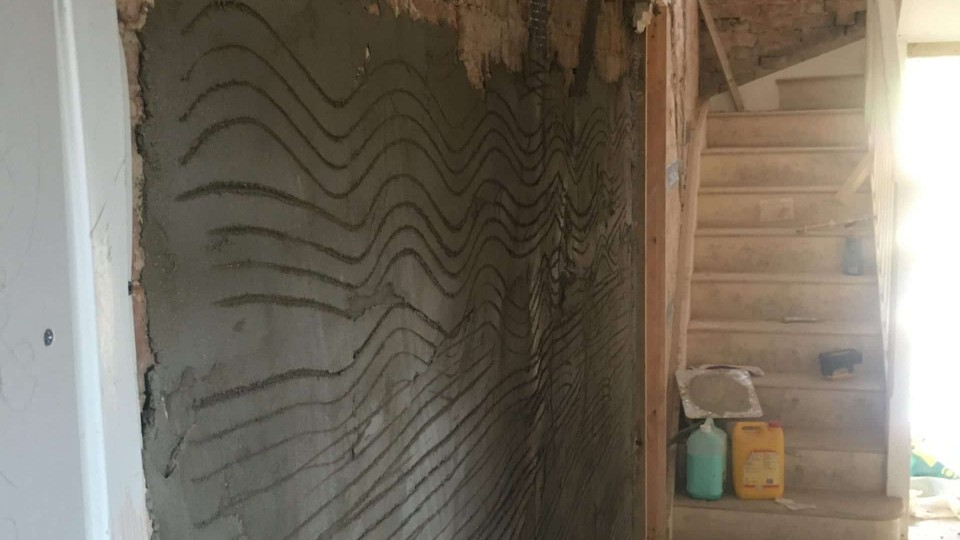 Walls being plastered